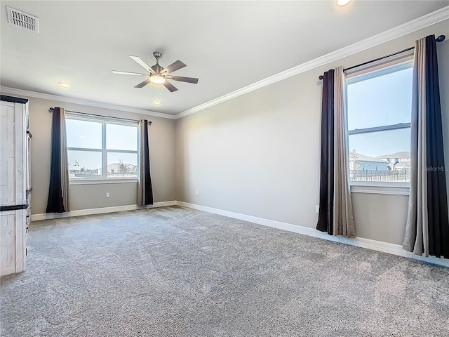 carpeted empty room with ornamental molding and ceiling fan