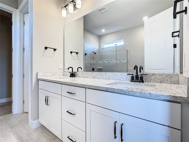 bathroom featuring vanity and walk in shower