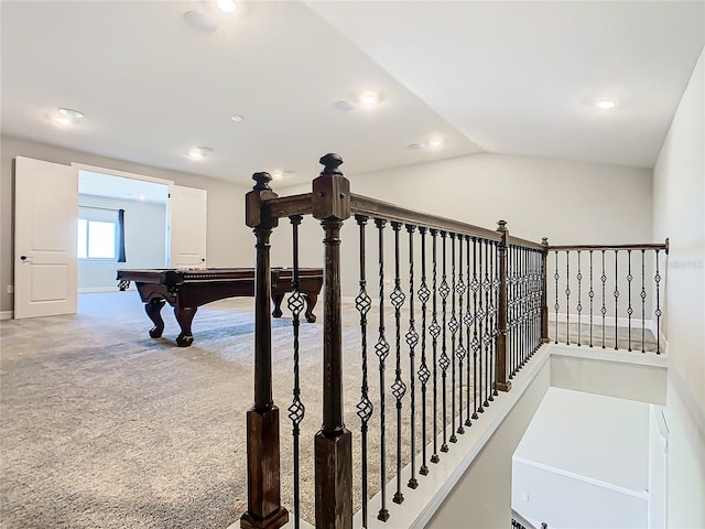 stairway with carpet flooring and vaulted ceiling