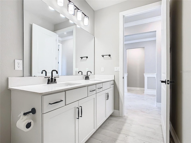 bathroom with vanity and crown molding