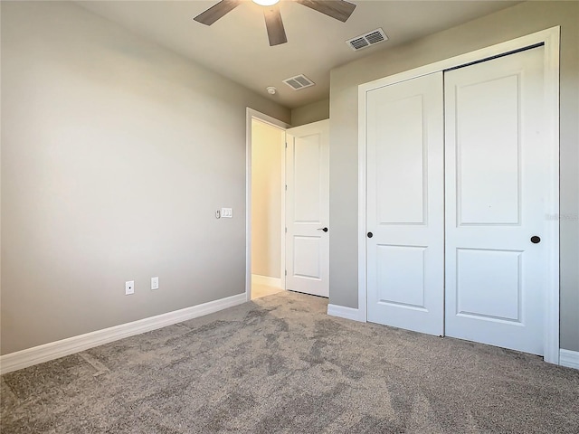 unfurnished bedroom with a closet, ceiling fan, and carpet flooring