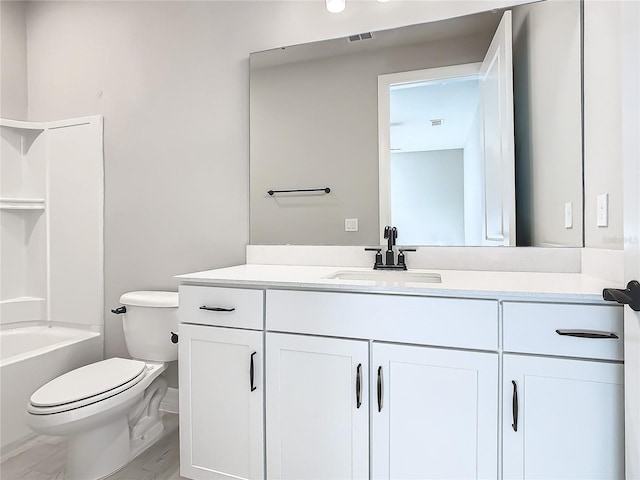 full bathroom featuring shower / bathtub combination, vanity, and toilet