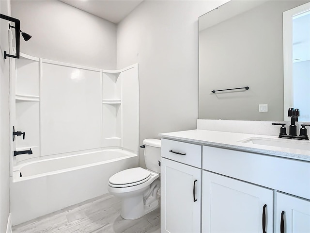 full bathroom with vanity, toilet, bathing tub / shower combination, and hardwood / wood-style floors