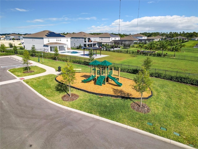 view of jungle gym with a lawn