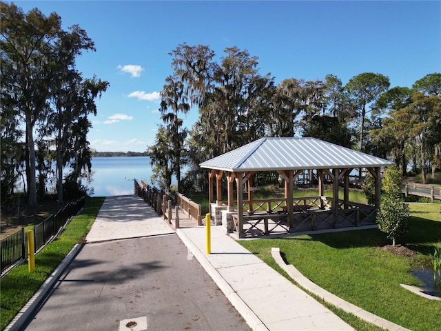 view of home's community featuring a water view, a yard, and a gazebo