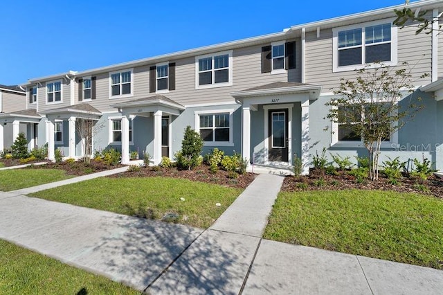 view of property with a front lawn