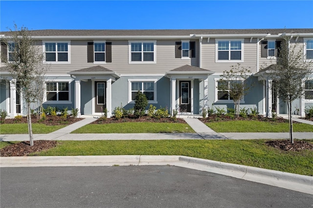 view of property featuring a front yard