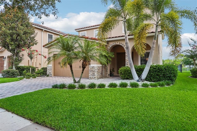 mediterranean / spanish-style house with a front lawn