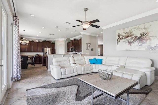 tiled living room featuring crown molding and ceiling fan