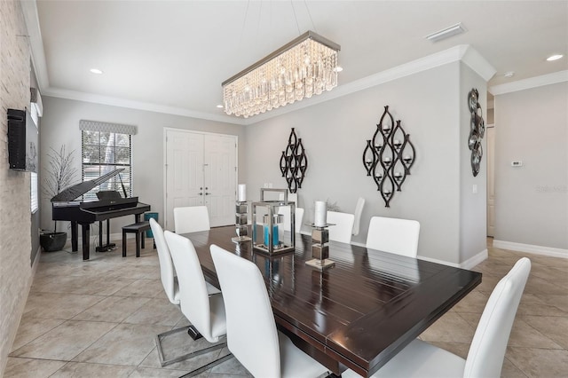 tiled dining room featuring ornamental molding and a chandelier