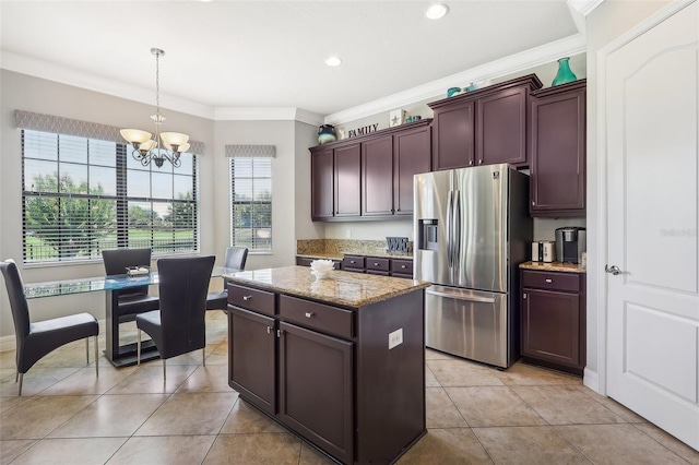 kitchen with a kitchen island, a chandelier, crown molding, hanging light fixtures, and stainless steel refrigerator with ice dispenser