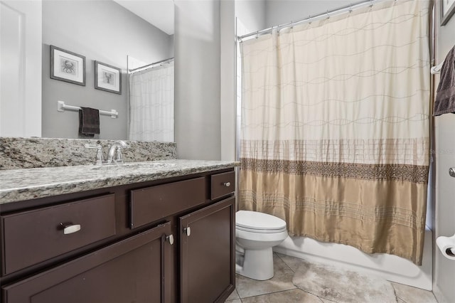 full bathroom with vanity, tile patterned floors, toilet, and shower / bath combo