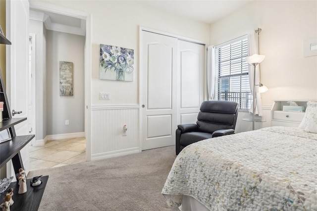 carpeted bedroom with a closet