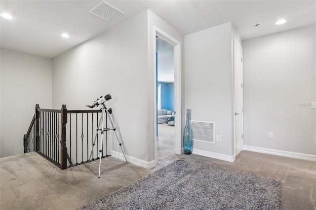 stairway with carpet flooring