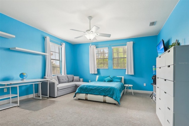 bedroom featuring light colored carpet and ceiling fan