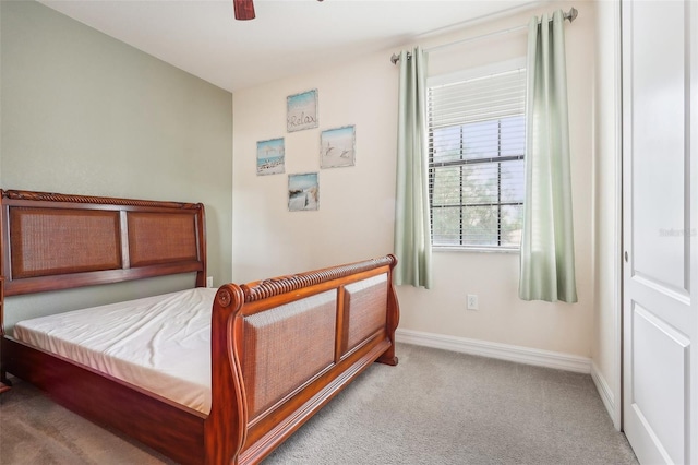 bedroom with light colored carpet and ceiling fan