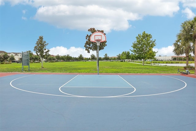 view of sport court featuring a yard