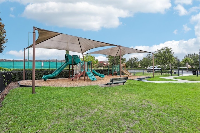 view of jungle gym featuring a yard and a water view