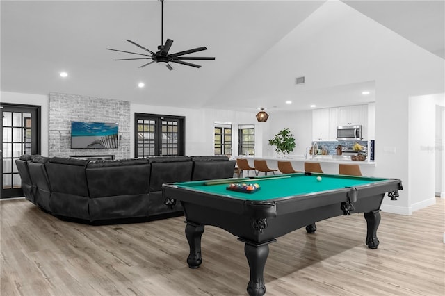 playroom featuring ceiling fan, french doors, light hardwood / wood-style flooring, high vaulted ceiling, and pool table