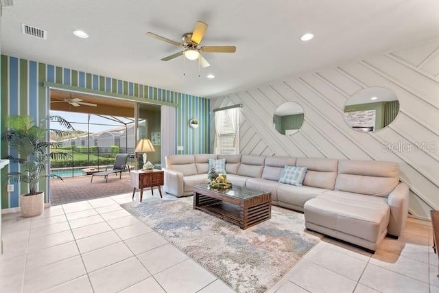 tiled living room featuring ceiling fan