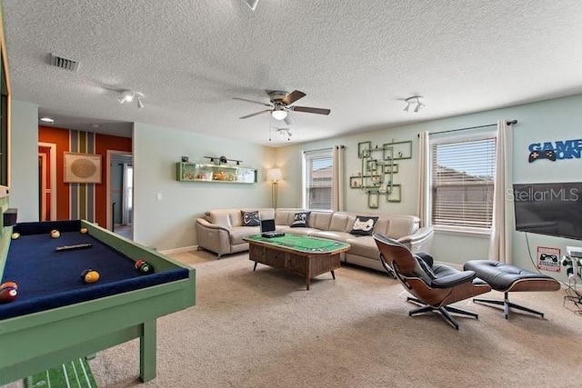 game room with billiards, ceiling fan, a textured ceiling, and carpet flooring