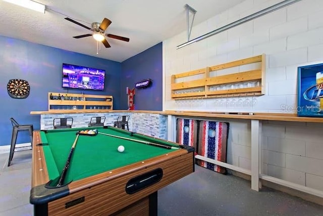 rec room with billiards, bar, and ceiling fan