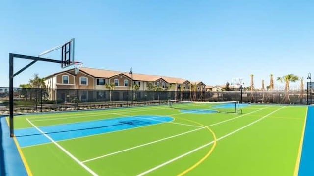 view of sport court featuring tennis court