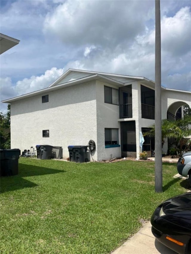 view of home's exterior featuring a yard