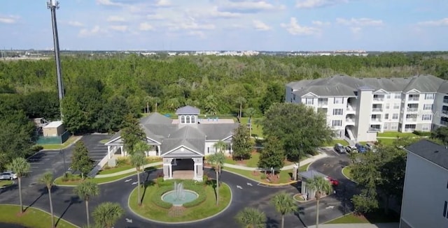 aerial view featuring a wooded view