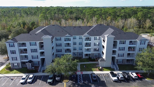 birds eye view of property with a forest view