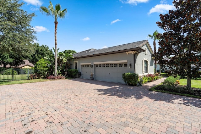 view of side of property featuring a garage