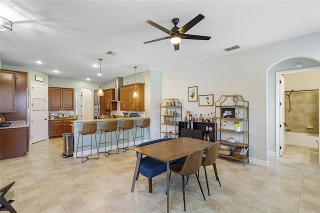 dining space with ceiling fan