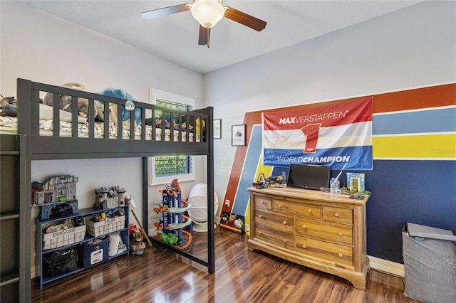 bedroom featuring dark wood-type flooring and ceiling fan