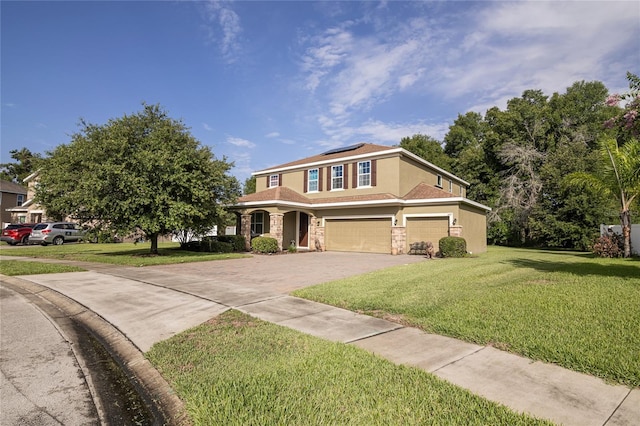 view of front of property featuring a garage, a front lawn, and solar panels