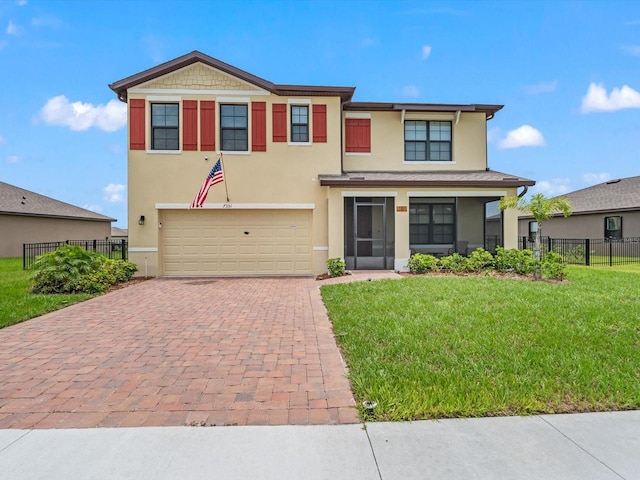 view of front of home featuring a garage and a front lawn