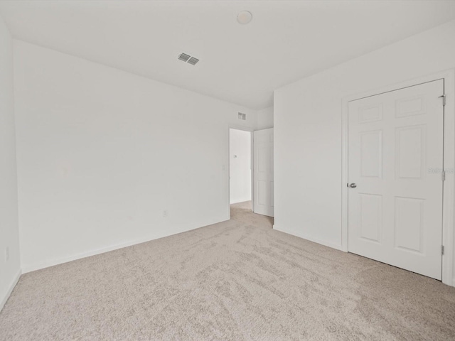 unfurnished bedroom with light carpet