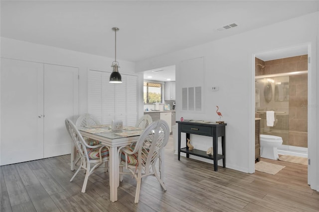 dining area with light wood-type flooring