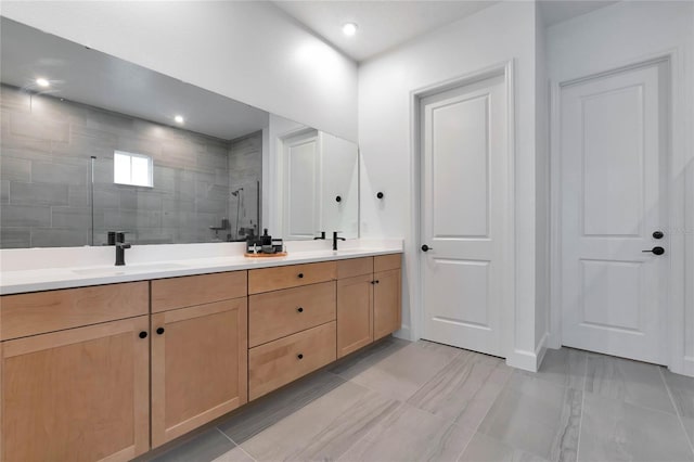 bathroom with vanity and walk in shower