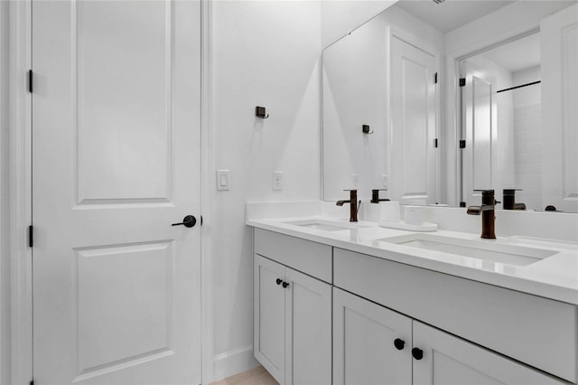 bathroom featuring vanity and a shower