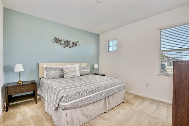 bedroom with light carpet