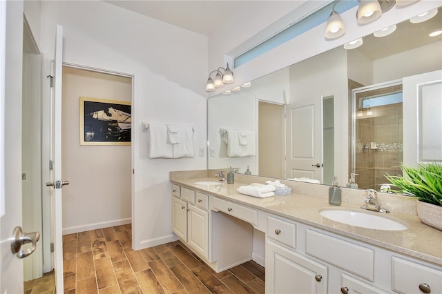 bathroom with vanity and a shower with shower door