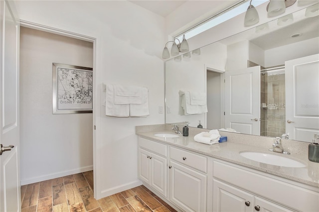 bathroom featuring vanity and a shower with shower door