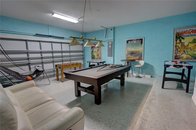 recreation room with electric panel and pool table