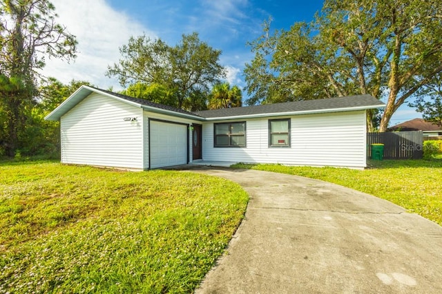 single story home featuring a front yard and a garage