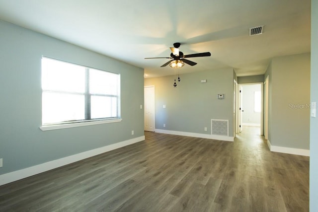 4230 Ponds Dr, Cocoa, FL 32927 - spare room featuring a ceiling fan, baseboards, and dark wood-style floors