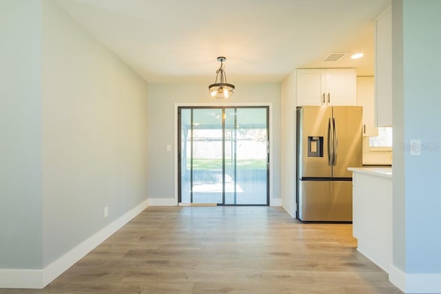 4230 Ponds Dr, Cocoa, FL 32927 - unfurnished dining area featuring light wood-type flooring and baseboards
