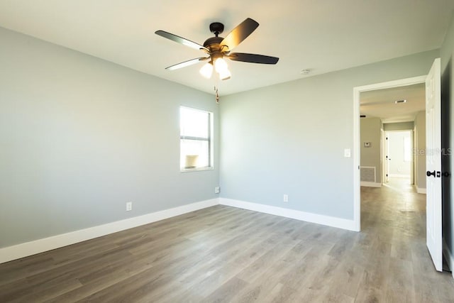 4230 Ponds Dr, Cocoa, FL 32927 - unfurnished room featuring a ceiling fan, light wood finished floors, and baseboards