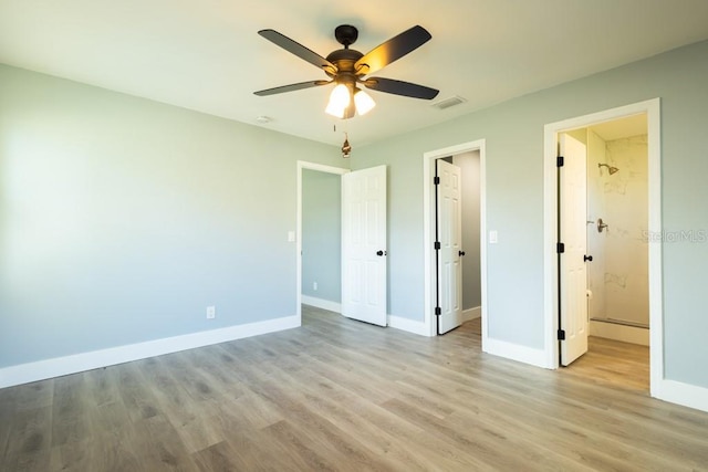 4230 Ponds Dr, Cocoa, FL 32927 - unfurnished bedroom with light wood finished floors, baseboards, and ceiling fan