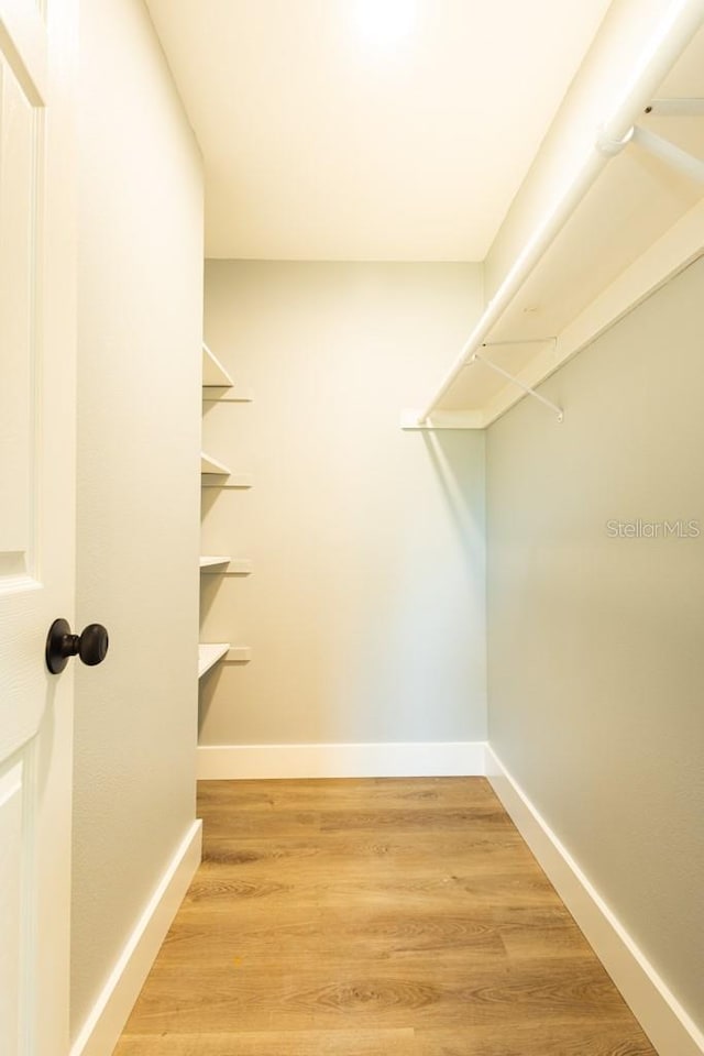 4230 Ponds Dr, Cocoa, FL 32927 - spacious closet featuring light wood-type flooring