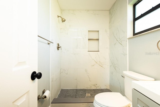 4230 Ponds Dr, Cocoa, FL 32927 - bathroom with toilet, a stall shower, vanity, and marble look tiles